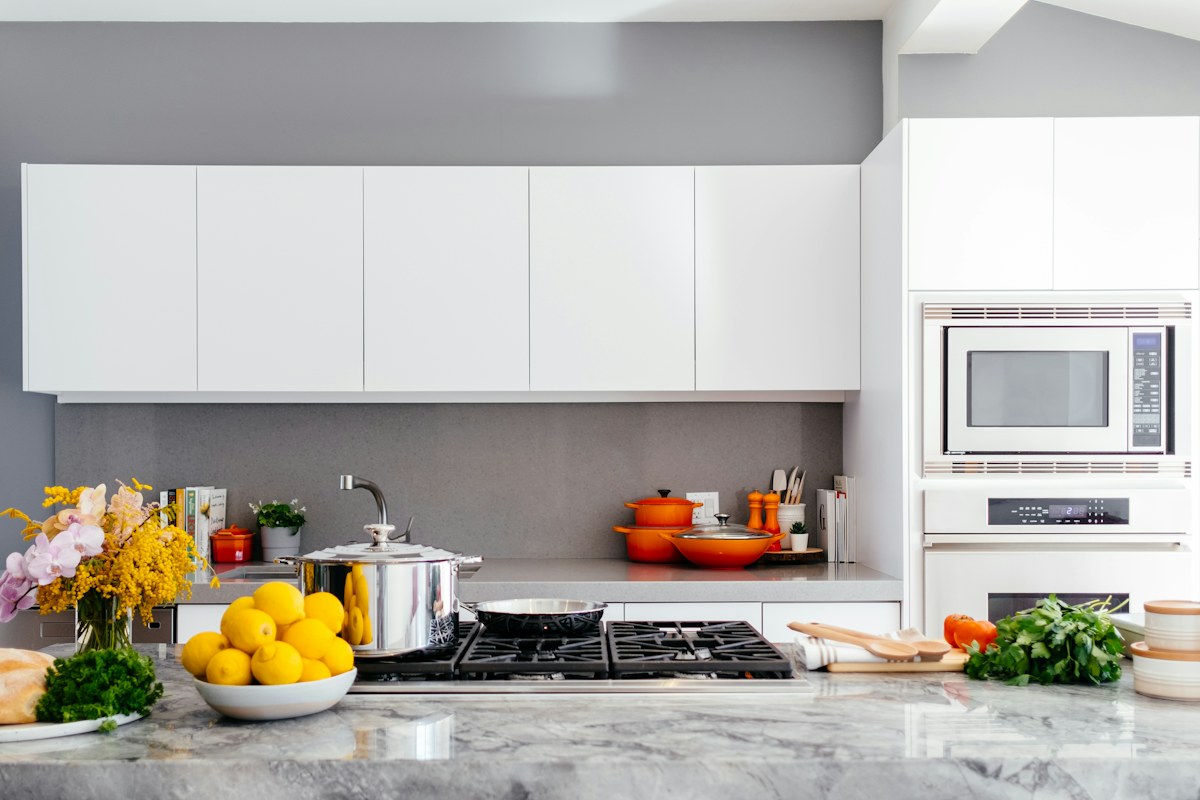 modern white kitchen with marble island