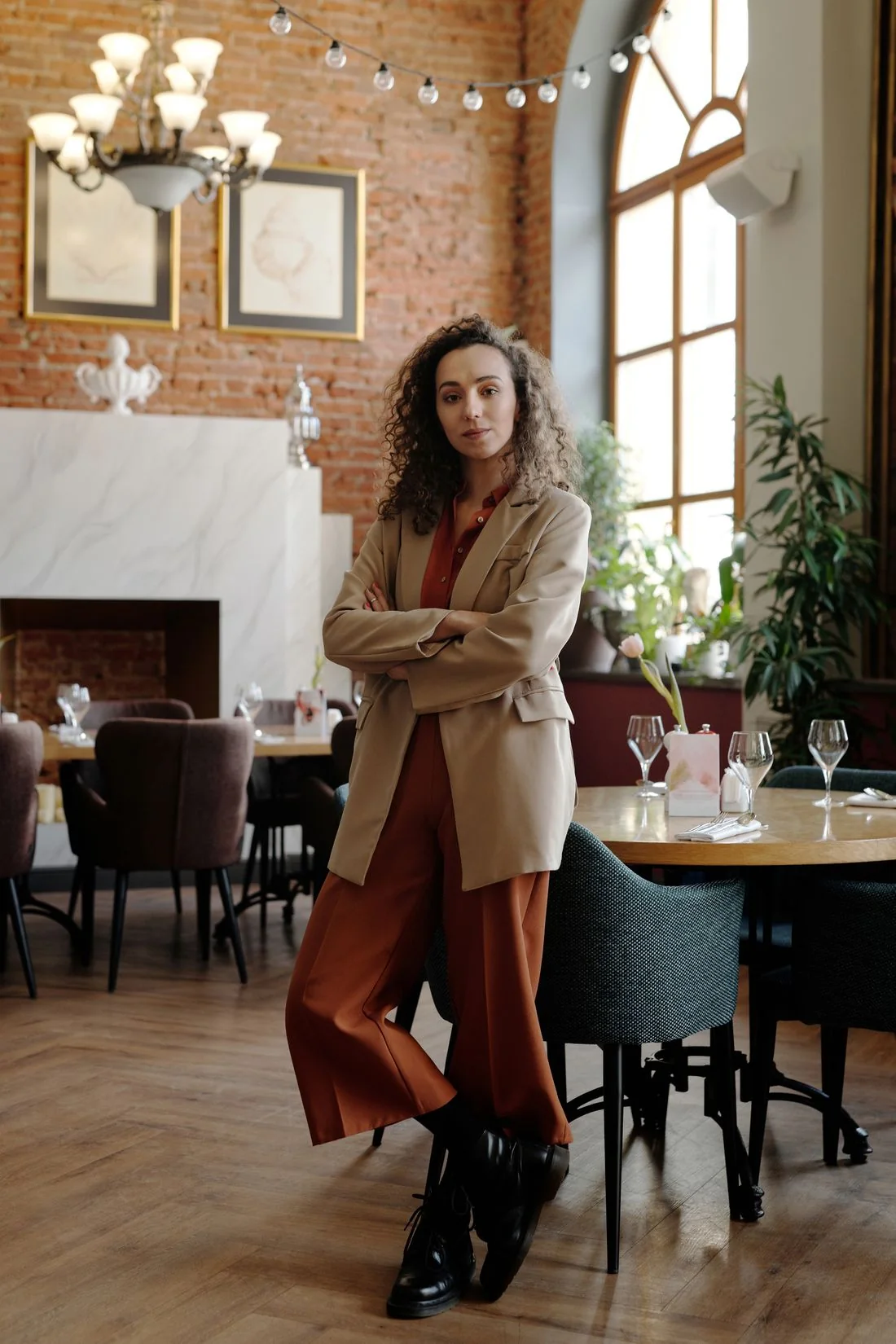 Woman in a restaurant beside a dining table