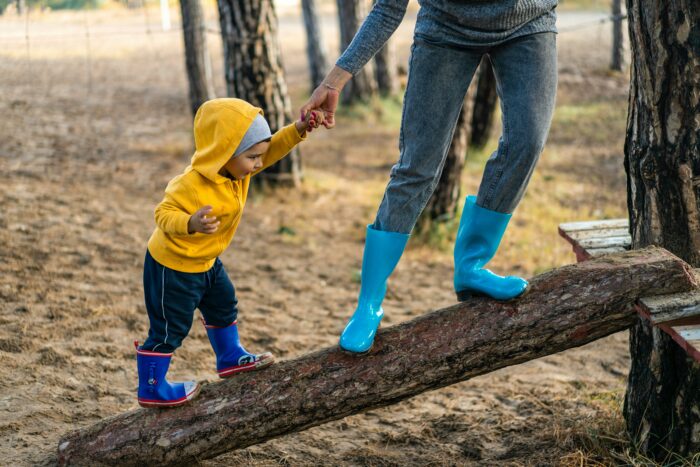 Vision Board Workbook image showing a mom and her child climbing on a log
